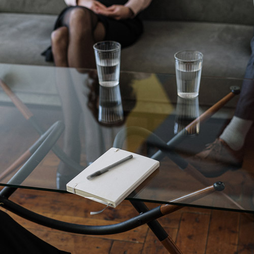 divorce in ontario, couple sits in front of a table with a notebook