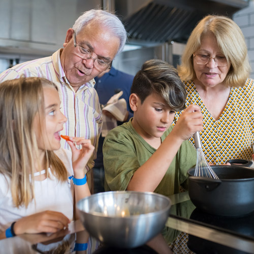 grandparents teach their grandkids to cook